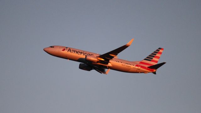 Boeing 737-800 (N908NN) - An evening departure from DFW as seen from Founder's Plaza. Not a lot of light to work with!