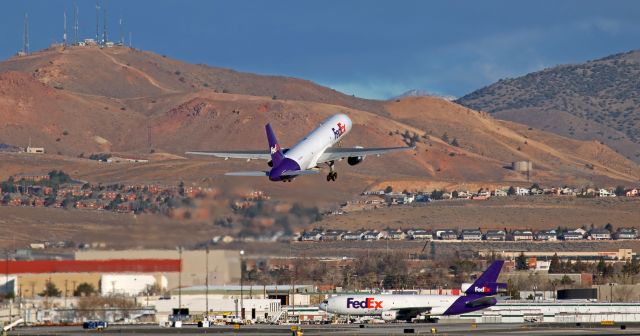 Boeing 757-200 (N964FD) - Fed Exs "Brooke" (N964FD) climbs out to the north as it departs Reno-Tahoe Internationals runway 34L.