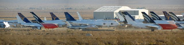 Airbus A300F4-200 — - A stitched panorama of various stored aircraft at Mojave Air and Space Port on November 25, 2014. At the center is a TWA Convair 880, a true rarity and longtime resident of MHV. 14 Boeing 747s are can be seen in frame.