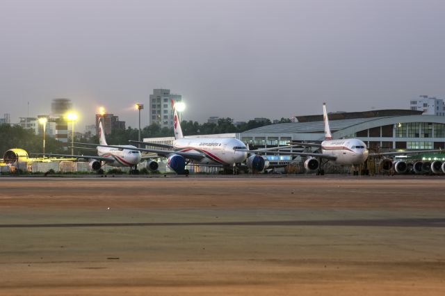 Boeing 777-200 (S2-AHL) - 13th March, 2017: DHAKAs PROFOUND WRECKAGE: Wrecked, retired or otherwise inactive aircraft of Biman Bangladesh Airlines fleet seen parked at the north end of the tarmac at Dhakas Zia International Airport. Seen in this shot (as well as S2-AHL, B772) are the two retired A310s (S2-ADF and S2-ADK), one Fokker F-28 (S2-ACV) and the partial remains of McDonnell DC-10-30 (S2-ACR).