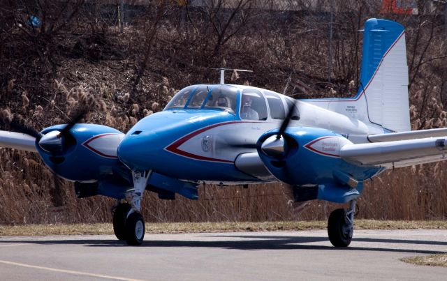 Beechcraft Twin Bonanza (N695PV) - Great engine sound! RW26 at KDXR. RELIANT AIR has the lowest fuel price on the Danbury (KDXR) airport.