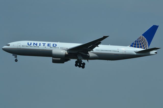 Boeing 777-200 (N772UA) - Photo taken in the Donald D. Engen Observation Tower at the Steven F. Udvar-Hazy Center of aircraft landing on Runway 1R at Washington/Dulles International Airport. This aircraft is also the first 777 to do a commercial flight.