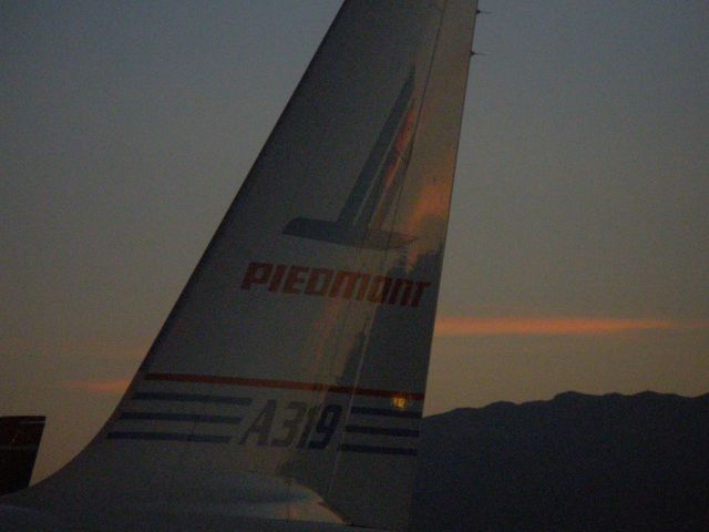 Airbus A319 (N744P) - Last of the daylight in LAS before the sun sets.