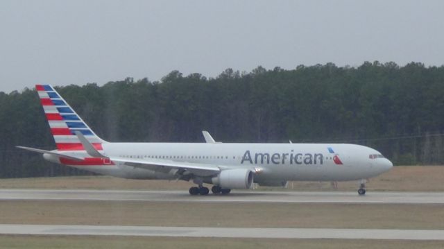 BOEING 767-300 (N372AA) - American 173 arriving from London LHR at the beginning of a shower!  Taken March 19, 2015.