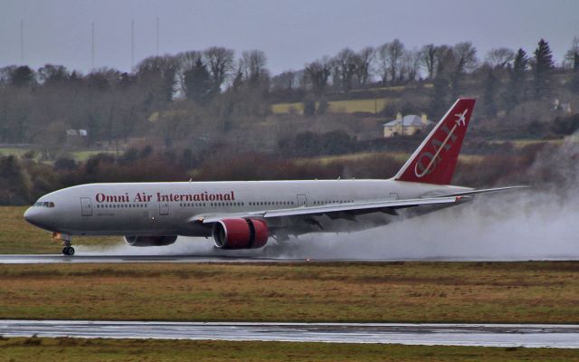 Boeing 777-200 (N918AX) - omni b777-2 n918ax landing at a very wet and stormy shannon airport 23/2/15.