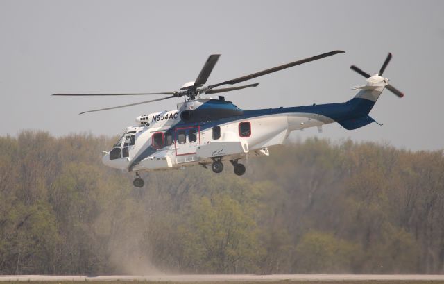 Eurocopter Super Puma (EC-225) (N554AC) - An Air Center Helicopters Eurocopter EC225 LP Super Puma kicking up dust as it departs Northwest Alabama Regional Airport, Muscle Shoals, AL - March 20, 2024.