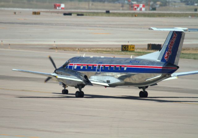 Canadair Regional Jet CRJ-700 (N271YV) - Sky West Embraer 120ER taxiing for departure from Denver International Airport. I like the paint scheme and I don't see many props anymore, but I suspect that will change when the Bombardier Dash 8 or Q-Series props come out.