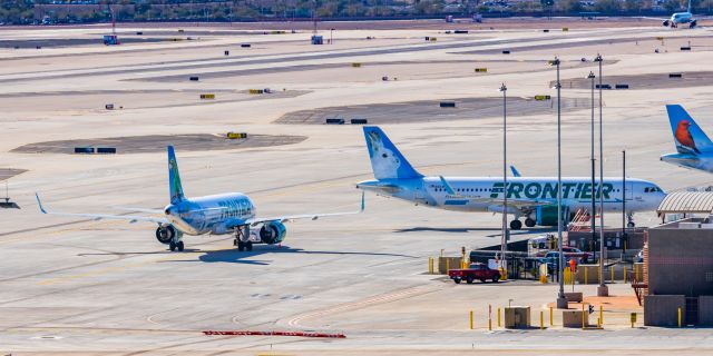 Airbus A320neo (N304FR) - A Frontier Airlines A320 neo "Jack the Rabbit" taxiing at PHX on 2/16/23. Taken with a Canon R7 and Tamron 70-200 G2 lens.
