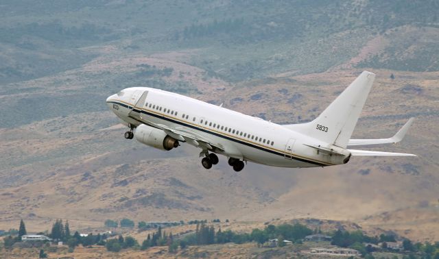 16-5833 — - A Navy C-40A (165833) on the climb away from 16R after a brief stop to drop off passengers.