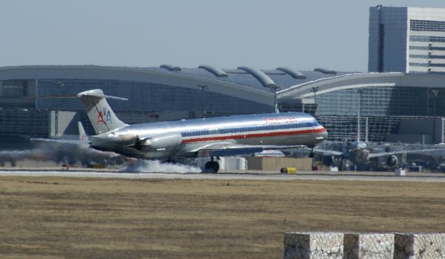 McDonnell Douglas MD-80 — - American Airlines MD-80 landing at KDFW. I liked the smoke in this shot.