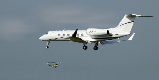 Gulfstream Aerospace Gulfstream IV (N131YF) - On final is this 2008 Gulfstream 450 while a AW139 Rotorcraft (N112EH) passes close by in the Autumn of 2020.