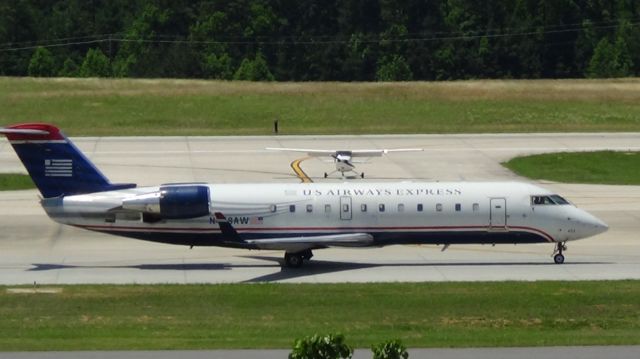 Canadair Regional Jet CRJ-200 (N458AW) - Small meats even smaller!  Taken June 7, 2015.