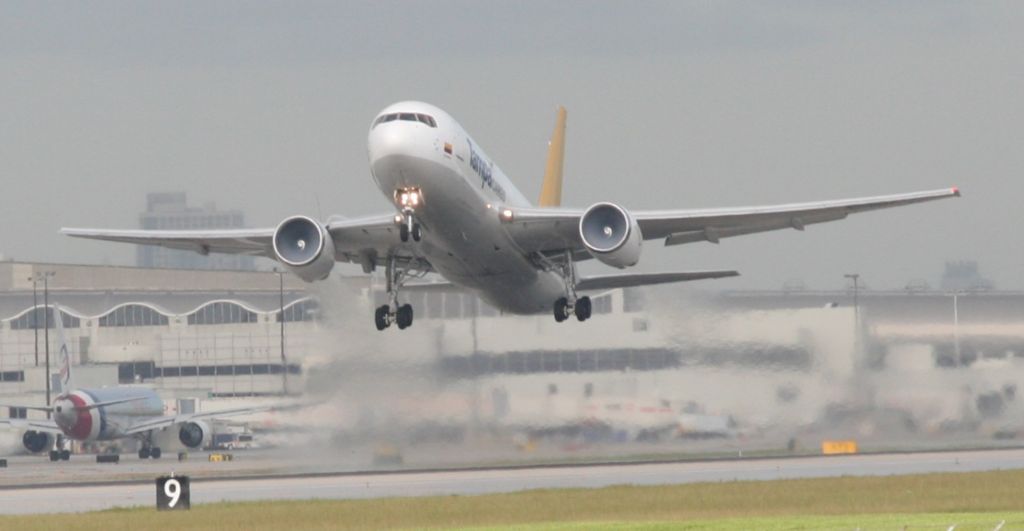 — — - Tampa Cargo Boeing 767-200 taking off from runway 27 at KMIA. Note condensation in engines.