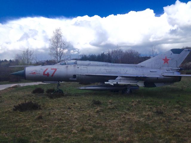 — — - Standing alone at the back of the museum: this old Russian fighter.