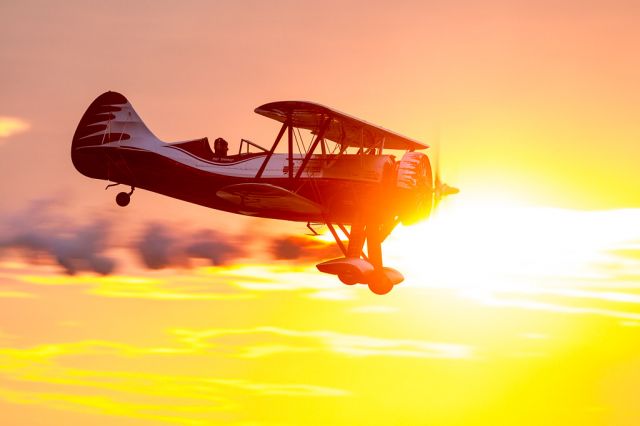 N669VP — - Kyle Franklin takes his custom WACO "Dracula" up for a spin at twilight during the Battle Creek Field of Flight.