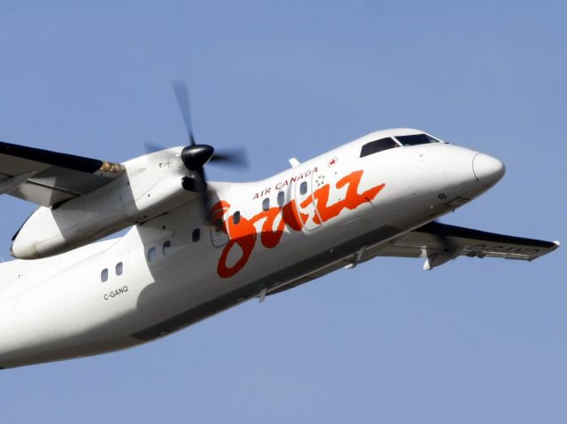 de Havilland Dash 8-100 (C-GANQ) - Close up takeoff shot as it flew overhead.