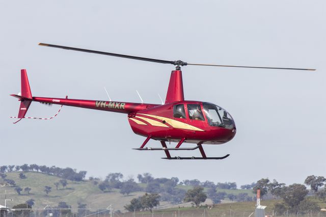 Robinson R-44 (VH-MXR) - Presner Pty. Ltd. (VH-MXR) Robinson R44 Raven landing at Wagga Wagga Airport.