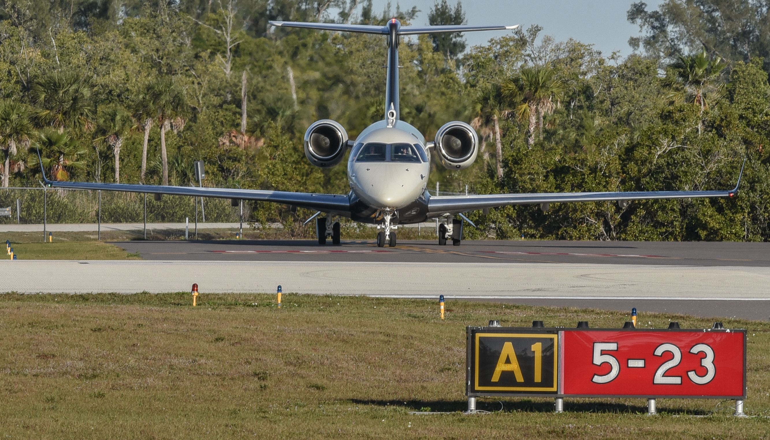 Embraer Legacy 550 (N404FX) - Awaiting take off clearance  RWY 05 , Naples , Florida