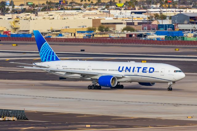 Boeing 777-200 (N771UA) - A United Airlines 777-200 taxiing at PHX on 2/13/23, the busiest day in PHX history, during the Super Bowl rush. Taken with a Canon R7 and Canon EF 100-400 II L lens.