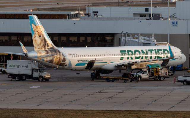 Airbus A321 (N715FR) - One of Frontier's A321s unloading baggage at gate A14.