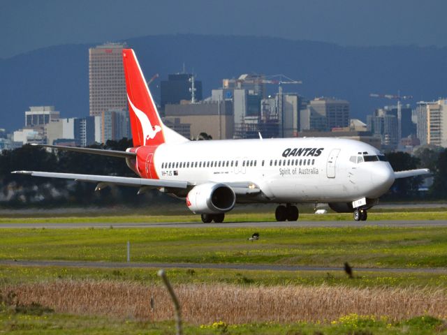 BOEING 737-400 (VH-TJS) - On taxi-way heading for take off on runway 05. Thursday 12th July 2012.