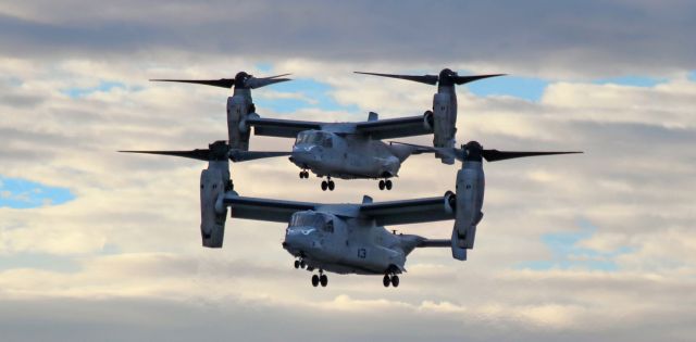 Bell V-22 Osprey (16-8350) - A pair of United States Marine Corps "Evil Eyes" MV-22B Ospreys (#13 - 168350 in the lead with #06 - 168018 directly behind), call sign "Keanu", are captured here in the last half hour of dusk light as they make their final approach along Reno Tahoe Internationals 16L to touch down at Atlantic Aviation. Both Ospreys are assigned to VMM 163 (Marine Medium Tiltrotor Squadron, 3rd Marine Aircraft Wing) "Evil Eyes" (formerly "Genie Eyes" - see below) at MCAS Miramar.br /This is the first photo of 168350 to be entered into FAs Photo Gallery.br /** The "Genie Eyes" name was inspired by the "I Dream of Jeannie" television sitcom; however, the "Evil Eyes" name was adopted when US ground forces in Vietnam began using that name to refer to VMM 163 aircraft supporting them. In 1966, all Marine units were directed to stop using white paint on their aircraft. VMM 163 commanders used an extremely technical detail to ignore the order and the "Evil Eyes" continued to be painted with black - and WHITE - paint. Later in that same year, as those same commanders were attending a meeting, they began catching hell for ignoring the directive - until a high ranking ground force officer commented on how great a morale boost it had been to see the "Evil Eyes" appear to support the ground forces during a recently-fought battle. The "Evil Eyes" have been black and white ever since.br /br /To read the entire history of VMM 163, click on the link below ....br /br /a rel=nofollow href=http://www.3rdmaw.marines.mil/Units/MAG-16/VMM-163/History/https://www.3rdmaw.marines.mil/Units/MAG-16/VMM-163/History//a