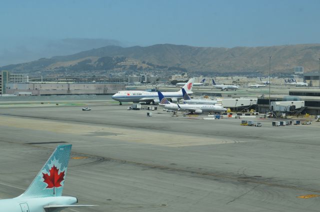 BOEING 747-8 — - A number of noontime planes at SFO as Air China 747-8 from Beijing taxies to gate.