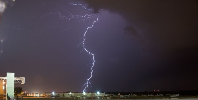 — — - Lightning strikes near KFDK on 5/3/2012.  Aircraft in the photo were unharmed.