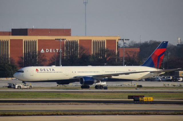 BOEING 767-400 (N830MH) - Delta Air Lines B767-400 being towed from remote parking to a hangar at Hartsfield-Jackson Atlanta International Airport...