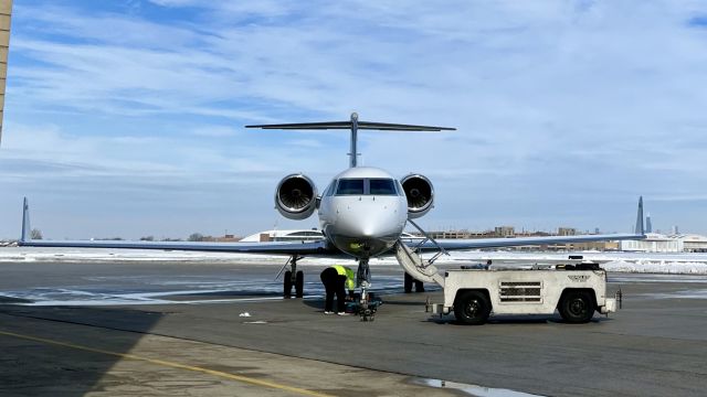 Gulfstream Aerospace Gulfstream IV (N778CR) - N778CR, a 2006 Gulfstream G450 (GIV-X), getting hooked up to a tug before getting pushed into it’s hangar @ Chicago Midway (MDW/KMDW). 2/5/22. 