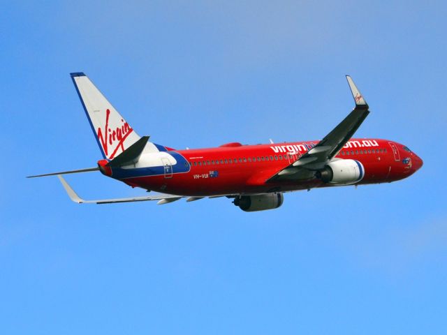 Boeing 737-700 (VH-VUI) - Getting airborne off runway 23 on a gloomy, cold winters day. Wednesday 4th July 2012.