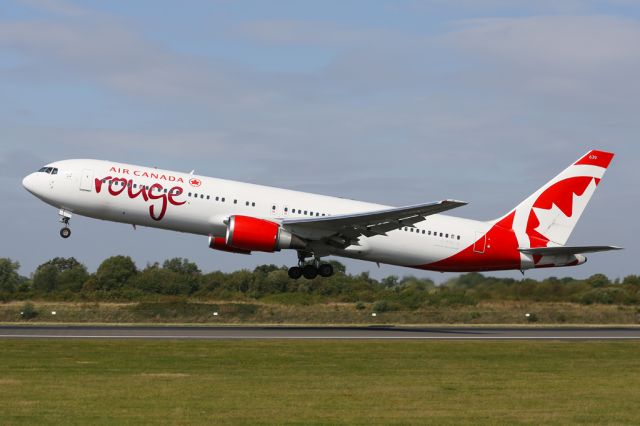 BOEING 767-300 (C-FXCA) - ROU1931 to Toronto, seen from the side of runway 23L on the southside of Manchester Airport.
