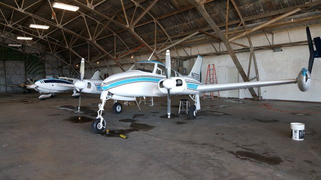 Cessna 310 (N6709X) - It just got washed and pushed back in the hangar. 