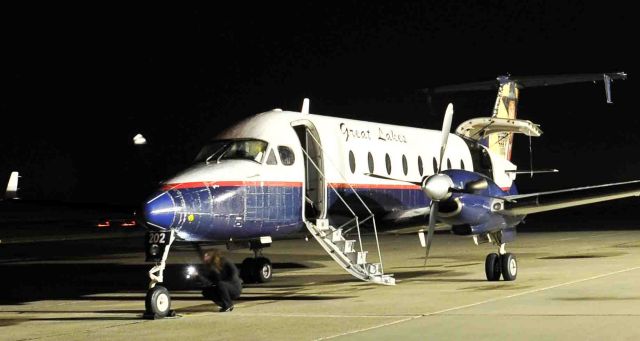 Beechcraft 1900 (N202GL) - Early morning pre-flight checks (note co-pilot by the nose wheel)br /GLA flight #46 (11/23/2014)