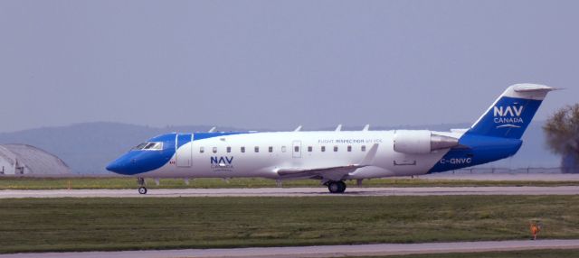 Canadair Regional Jet CRJ-200 (C-GNVC) - Taxiing to parking is this NAV Canada Mitsubishi Canadair Regional Jet 200ER in the Spring of 2024.
