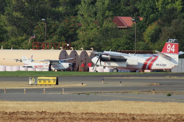 Cessna Skyhawk (N679DC) - KRDD - human tow vehicles move the DynCorp Cessna to the Chiefs hangar....