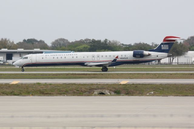 Canadair Regional Jet CRJ-900 (N942LR) - Mesa/US Air Flight 2647 (N942LR) departs Runway 32 at Sarasota-Bradenton International Airport enroute to Charlotte/Douglas International Airport