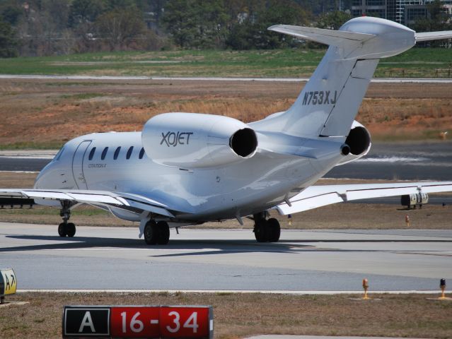 Cessna Citation X (N753XJ) - XOJET INC taxiing to runway 21L - 4/6/13