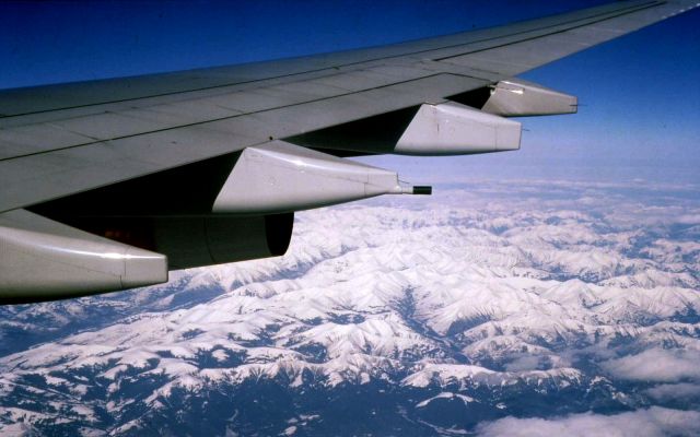 — — - SAS flight from Tokyo to Copenhagen - back in March 2003. One of those perfect days for flying. Cold, clear, still air right across China and Russia kept us glued to the window all day. Love the colour of the sky at that altitude.