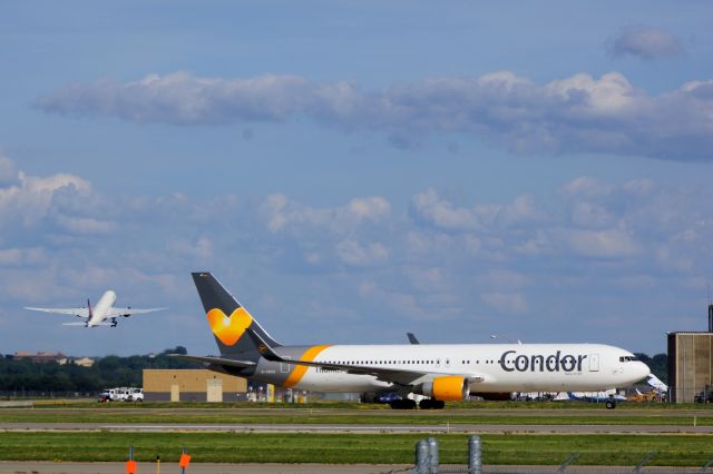 D-ABUZ — - Condor 767 just in from Frankfurt, as DL 777 lifts off in the background.