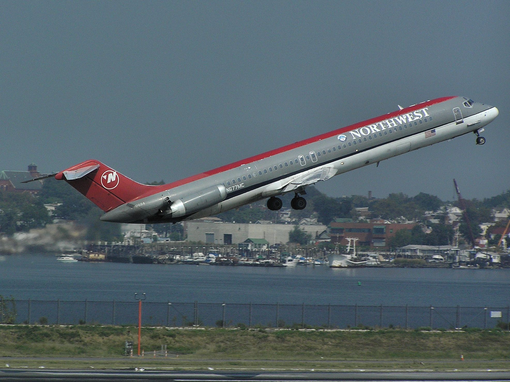 McDonnell Douglas DC-9-50 (N677MC) - NW DC-9-50 N677MC makes a very steep departure off Runway 13 at KLGA on Sept 13, 2005 wearing a less than pristine paint job. Built in 1977 this -50 has flown for Austrian, Muse Air, Eastern, Northwest, and is still flying the skies with Delta in 2011.
