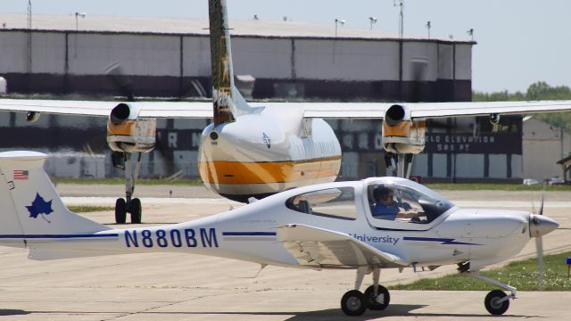 Diamond Star (N880BM) - One of Indiana State’s Diamond DA40’s taxiing past the US Army Parachute Team, aka the Golden Knights, in their De Havilland Canada C-147A. 5/5/23