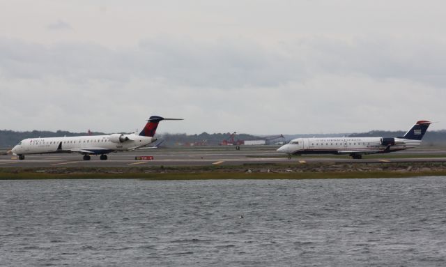 Canadair Regional Jet CRJ-200 (N412AW) - Quite a comparison between the bigger new CRJs and the older shorter CRJs