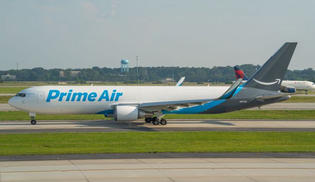 N571AZ — - Prime Air B767 - holding for a takeoff slot.  ISO 50 with tripod for clarity.  Normal hazy Atlanta day.