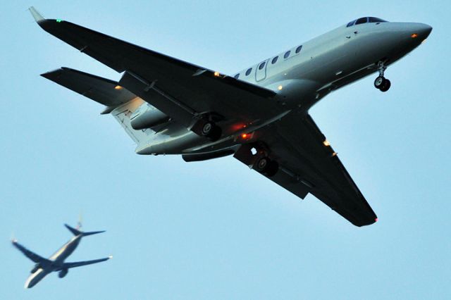 Bombardier Challenger 300 (N541XJ) - 1/26/12:  this CL30 is on short final approach over the Golf Course Village section of Miami Lakes enroute to runway 9-L at Opa-locka Executive Airport.  The American B737-823 N836NN is on a downwind leg bound for Miami International as flight 1049.