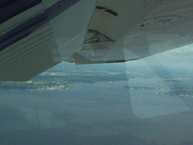 Cessna Skyhawk (N262EE) - Flaps down, over Lake Conroe.