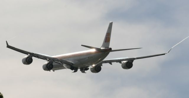 — — - Iberia A340-600 departing KMIA runway 27. Note wingtip trails, condensation on wings, and reflection of sun. (Go to large view before you give me a bad rating, you trolls)