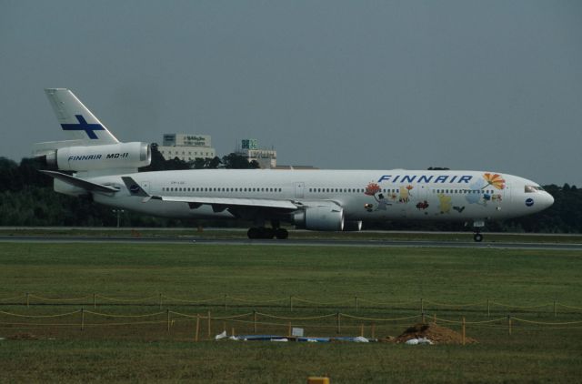 Boeing MD-11 (OH-LGC) - Departure at Narita Intl Airport Rwy16R on 1996/09/29 " Mumin c/s "