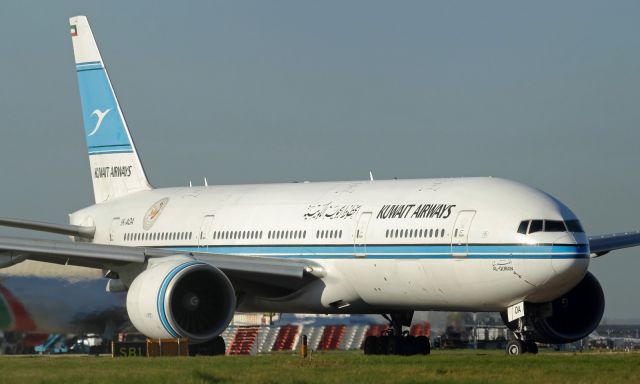 Boeing 777-200 (9K-AOA) - Holding short of runway 027L at LHR.