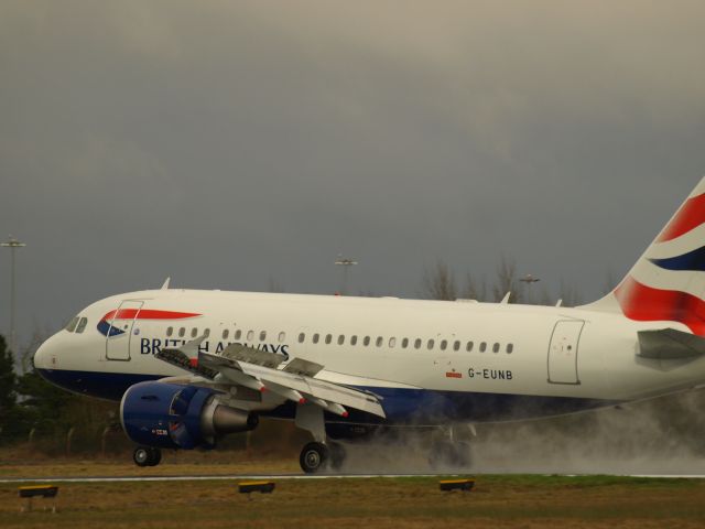 Airbus A318 (G-EUNB) - Full reverse thrust on landing on rwy 06 on a wet spring day